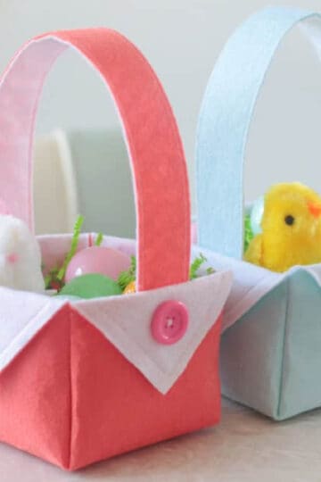 Two felt Easter baskets filled with eggs and toys.