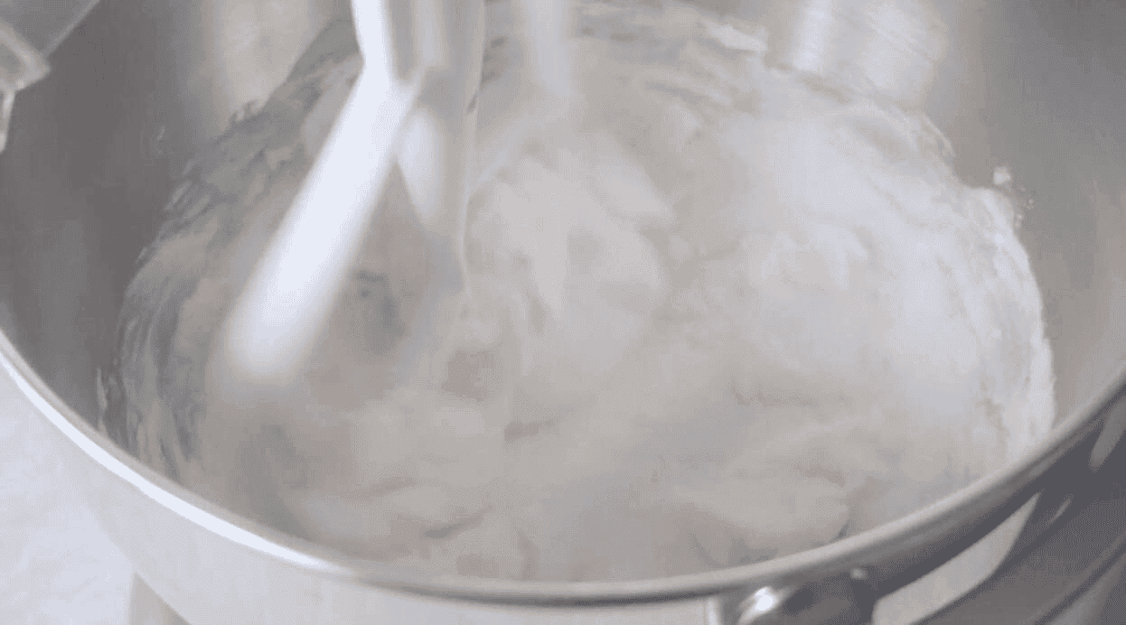 Bowl of sugar and butter in stand mixer.