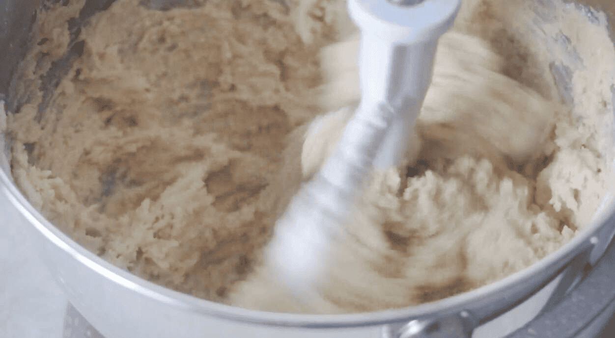 Stand mixer mixing cookie dough.