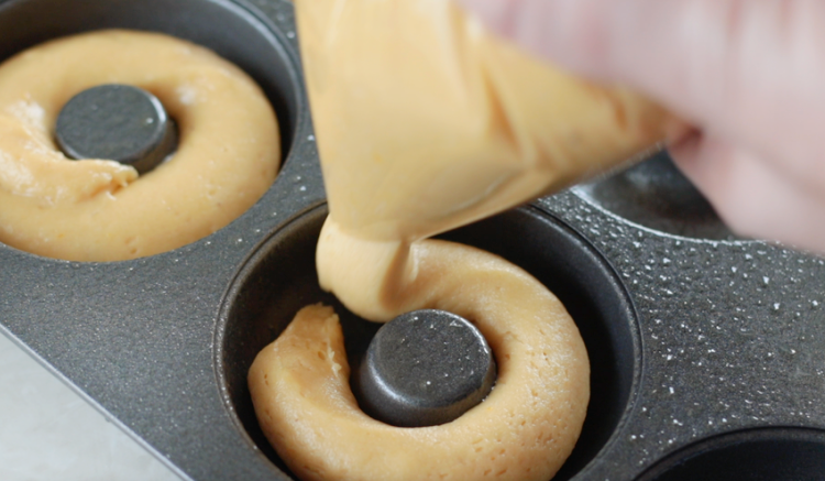 unbaked donut batter in pan