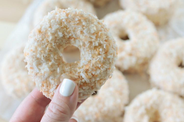 hand holding coconut crunch donut