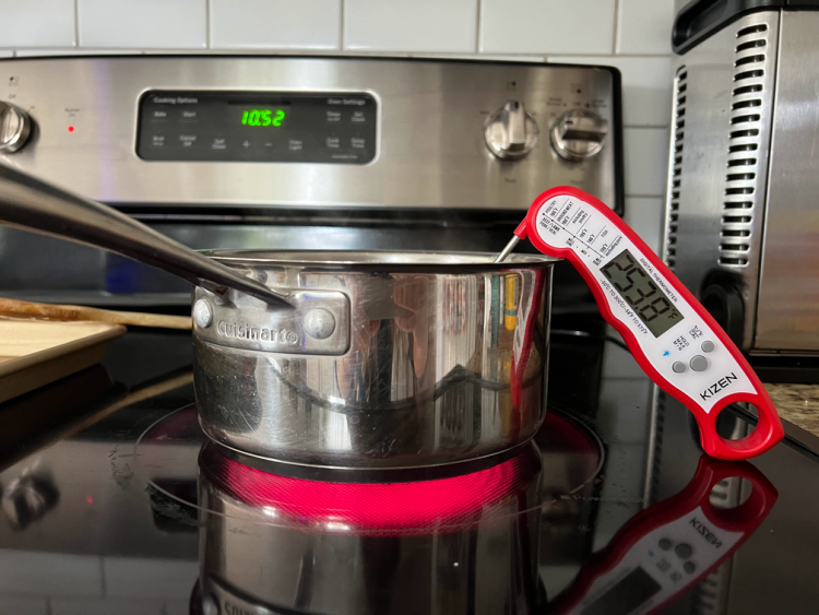 pan on the stove with candy thermometer