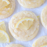 glazed lemon cookies on parchment paper