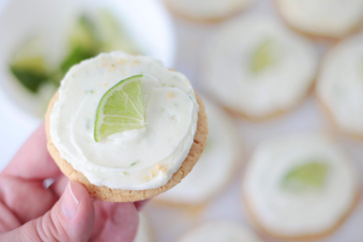 hand holding frosted key lime pie cookie