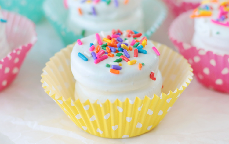 white chocolate covered oreo stack in yellow muffin liner