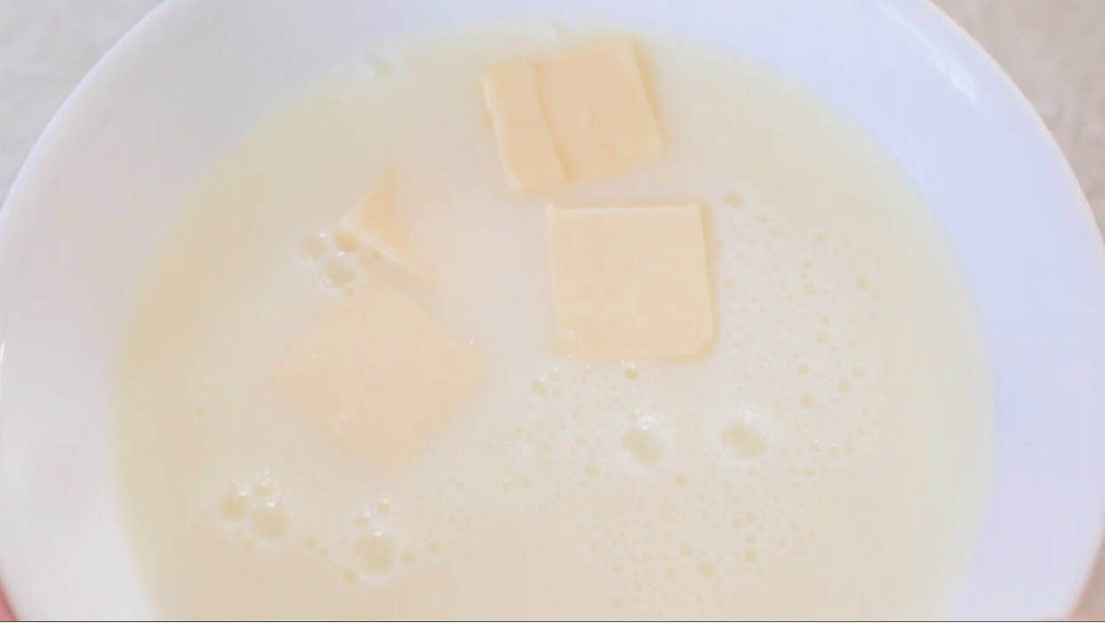 Bowl of milk and melted butter.