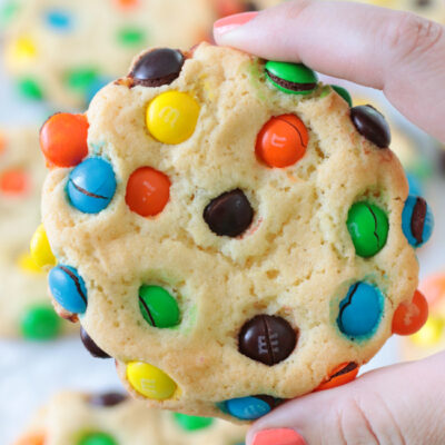 hand holding bakery style M&M cookie