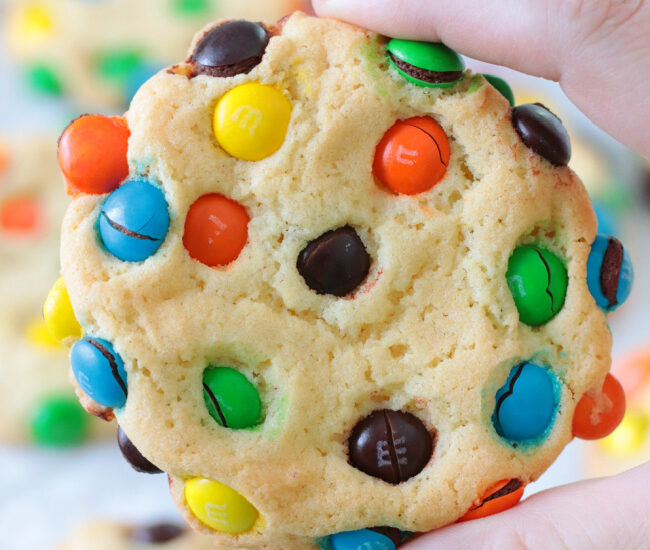 hand holding bakery style M&M cookie