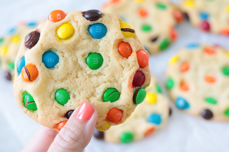 hand holding M&M cookie