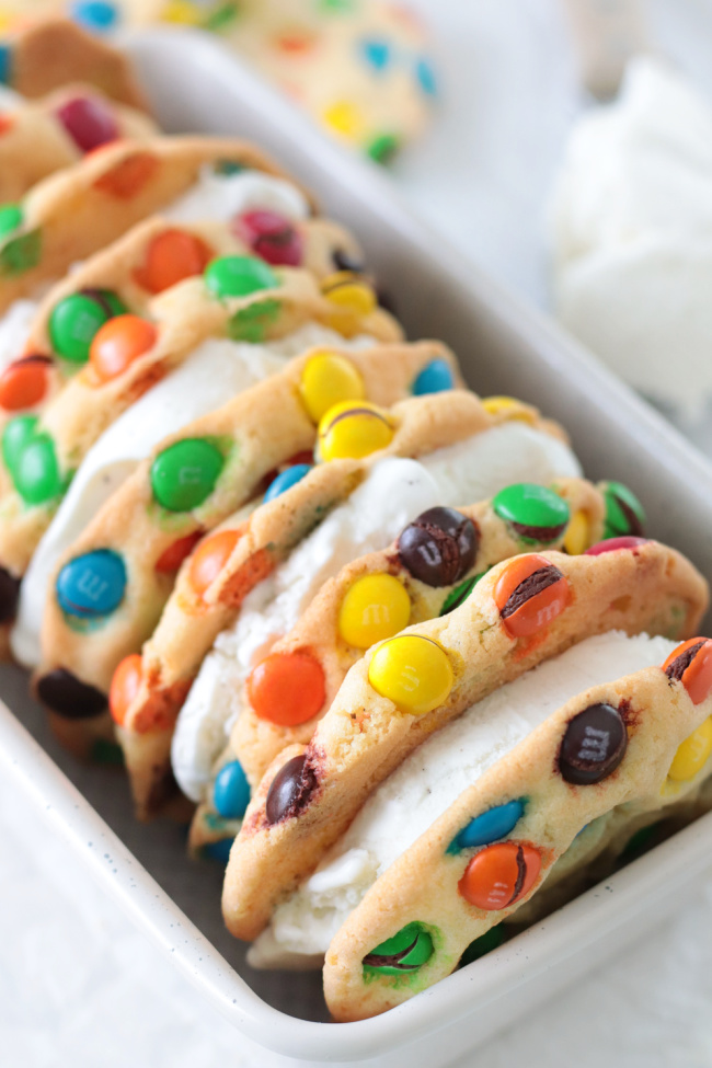 loaf pan of M&M ice cream sandwiches