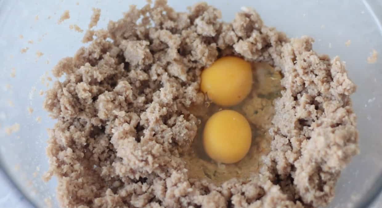 Bowl with creamed butter and sugars and eggs.