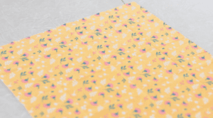 square of yellow floral fabric