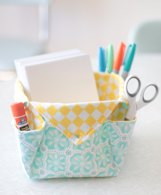 fabric storage basket filled with office supplies