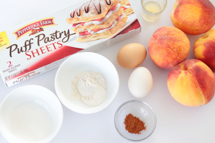 box of puffed pastry, eggs, cinamon, 4 peaches, lemon juice and bowls of sugar and flour