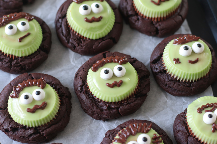 chocoalte reese's frankenstein cookies on parchment paper