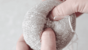 needle and thread in sock pumpkin