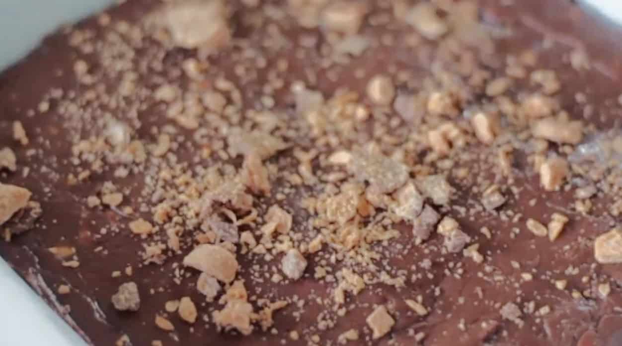 Butterfinger fudge pressed into pan.