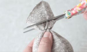 scissors trimming the end of a sock