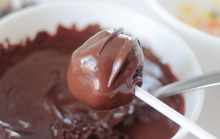 brownie pop dipped into chocolate