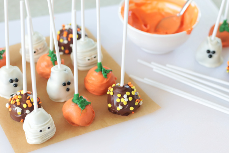 halloween brownie pops on parchment paper