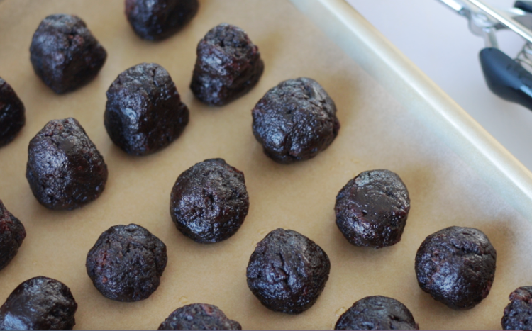 balls of brownie bites on parchment paper