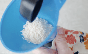 funnel of rice inside sock