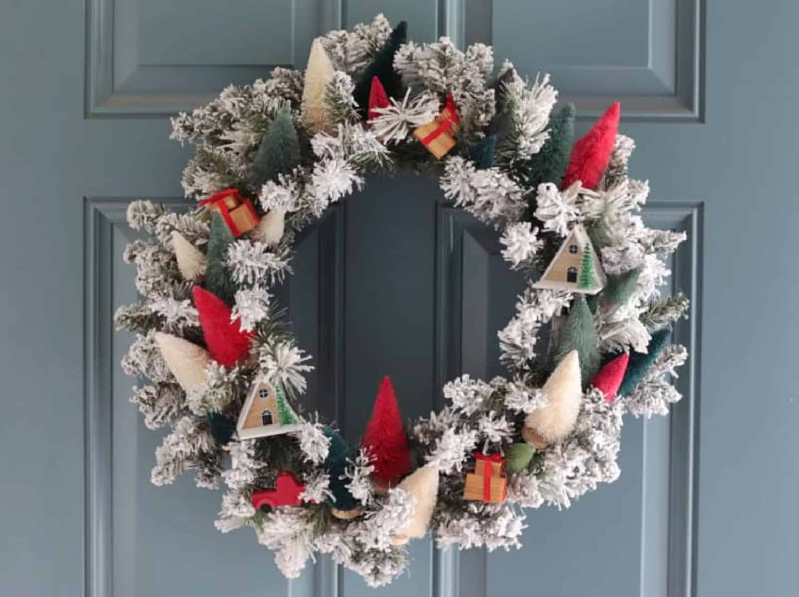 Wreath with bottlebrush trees attached in a variety of colors.