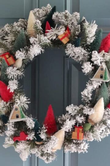 Wreath with bottlebrush trees attached in a variety of colors.