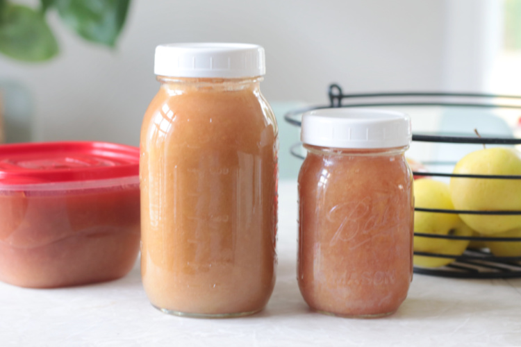 two jars and one container of applesauce