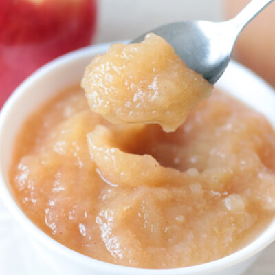 bowl of applesauce with spoon