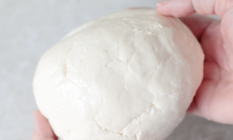 hands holding ball of peppermint patty dough
