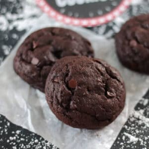 Coal cookies on parchment paper.