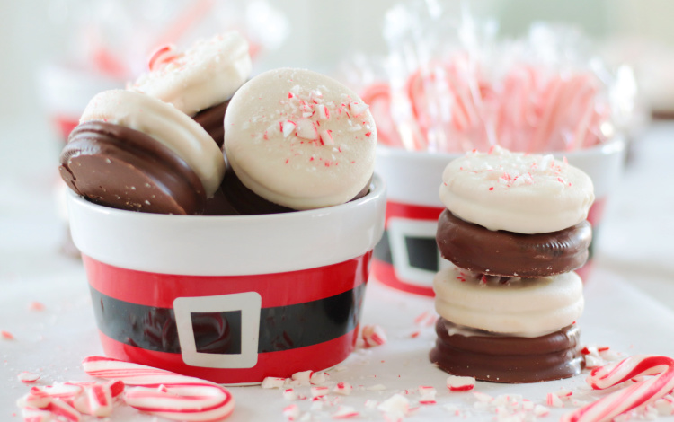 peppermint bark oreos stacked and in santa cup