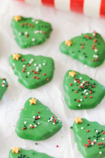 Shortbread tree cookies dipped in green melting chocolate.
