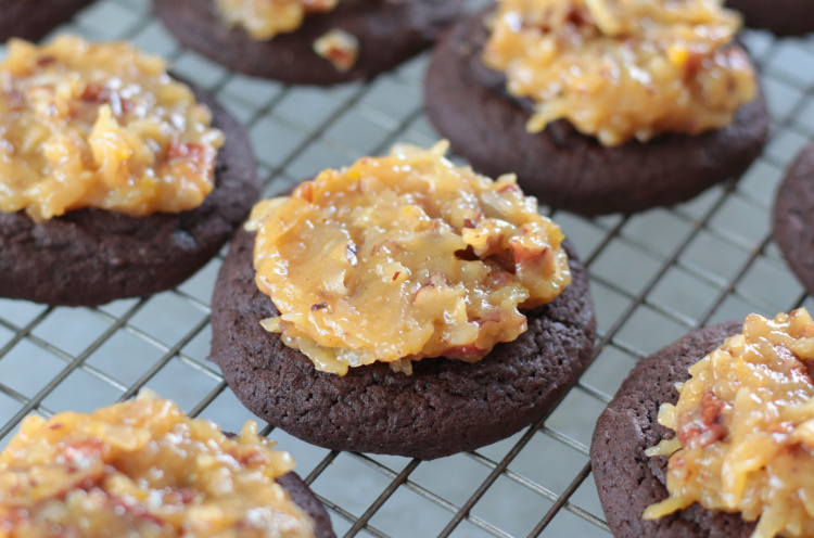 chocolate cookie with coconut pecan frosting spread over it