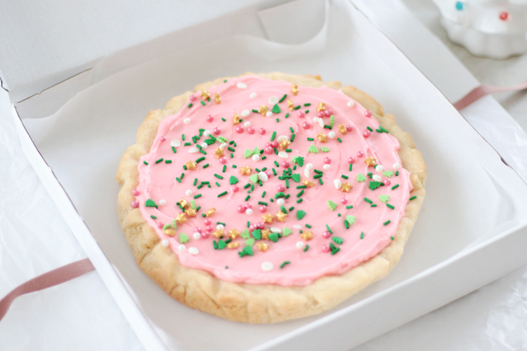 giant pink sugar cookie in pizza box