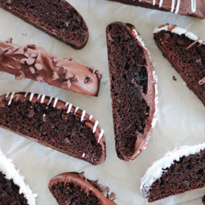 chocolate dipped biscotti on baking sheets