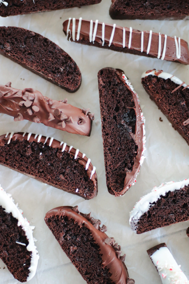 chocolate dipped biscotti on baking sheets