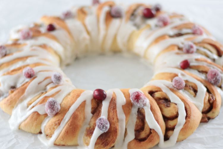 cinnamon roll wreath with cranberries on top