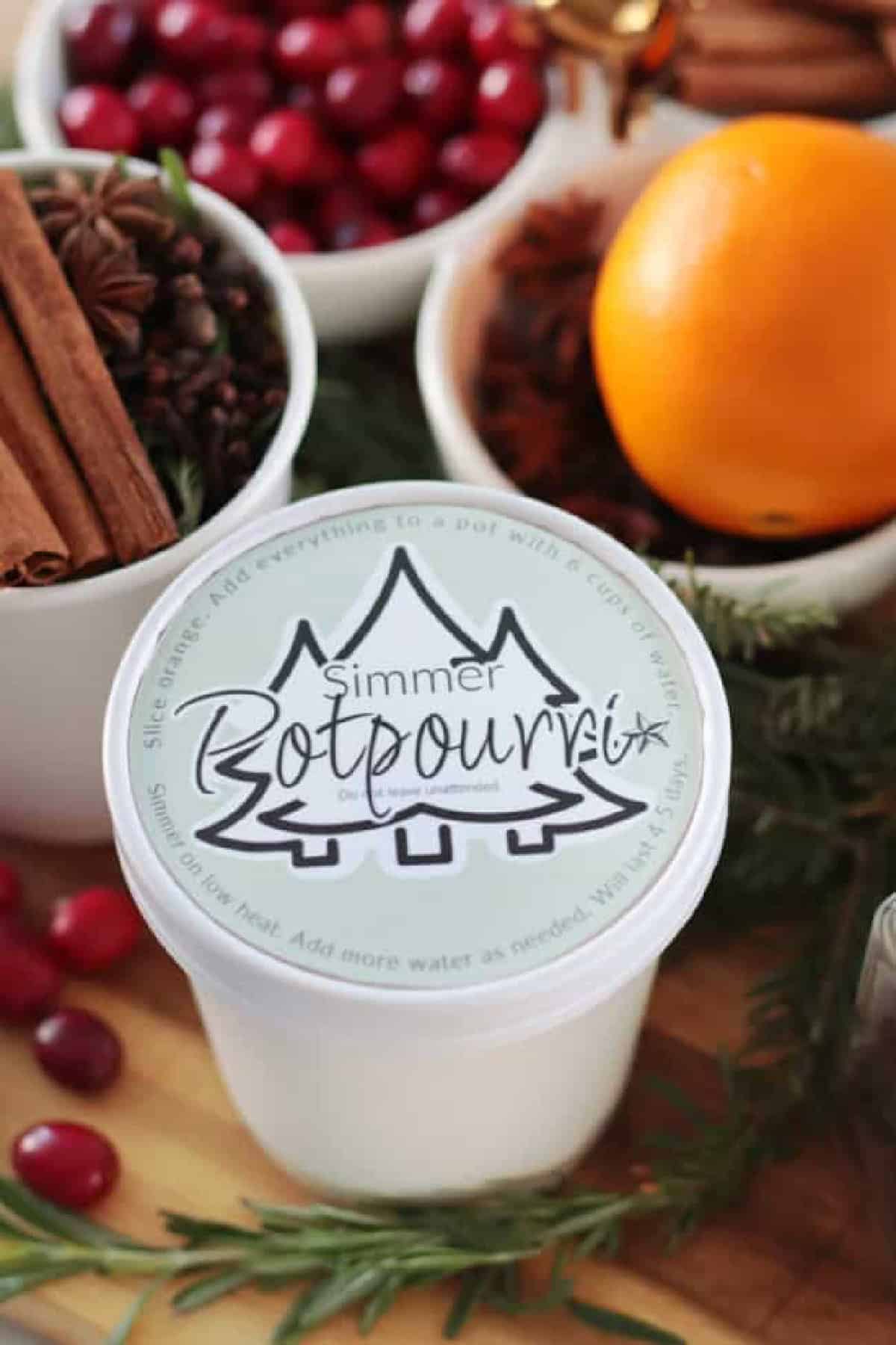 Container of simmer pot potpourri.