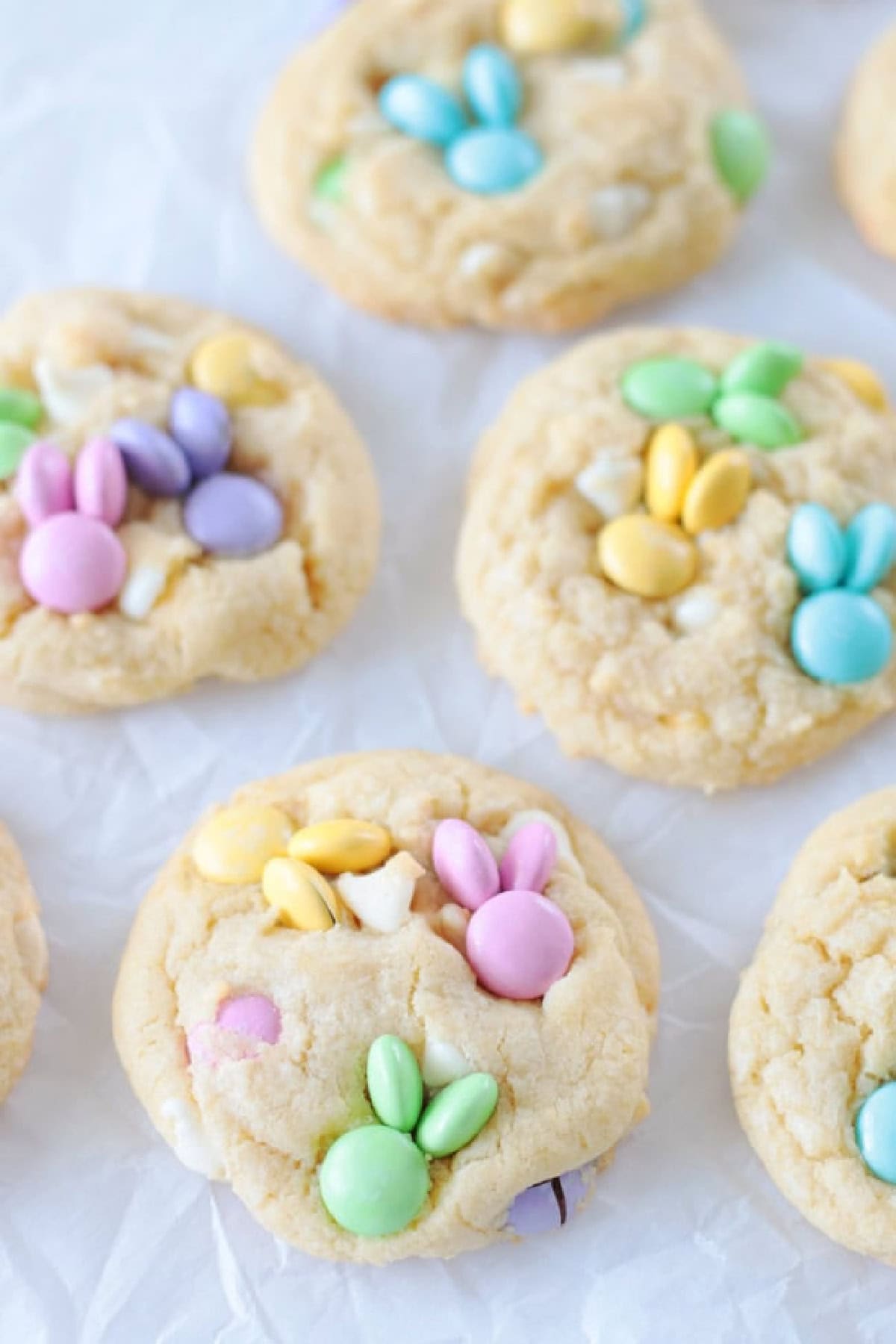 Cookies with pastel M&M candies pressed into them.