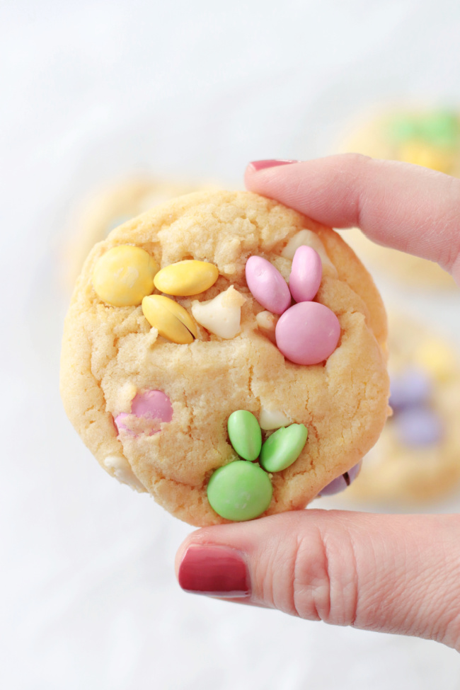 hand holding easter M&M cookie