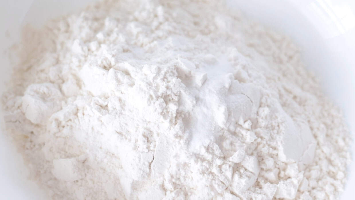Bowl of flour, baking soda, baking powder and salt.