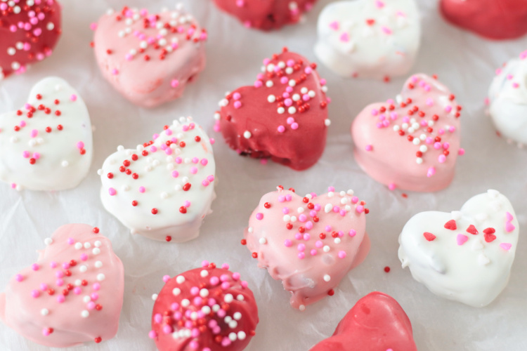heart-shaped brownie truffles on parchment paper