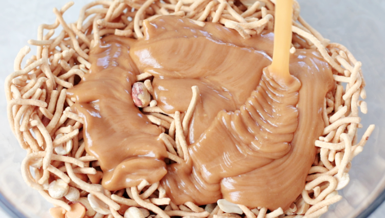 peanut butter sauce poured over crunchy chow mein oodles
