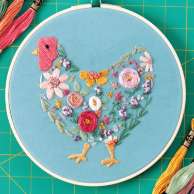 floral chicken embroidery project in embroidery hoop