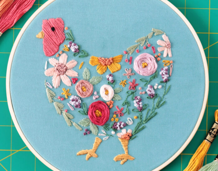 floral chicken embroidery project in embroidery hoop