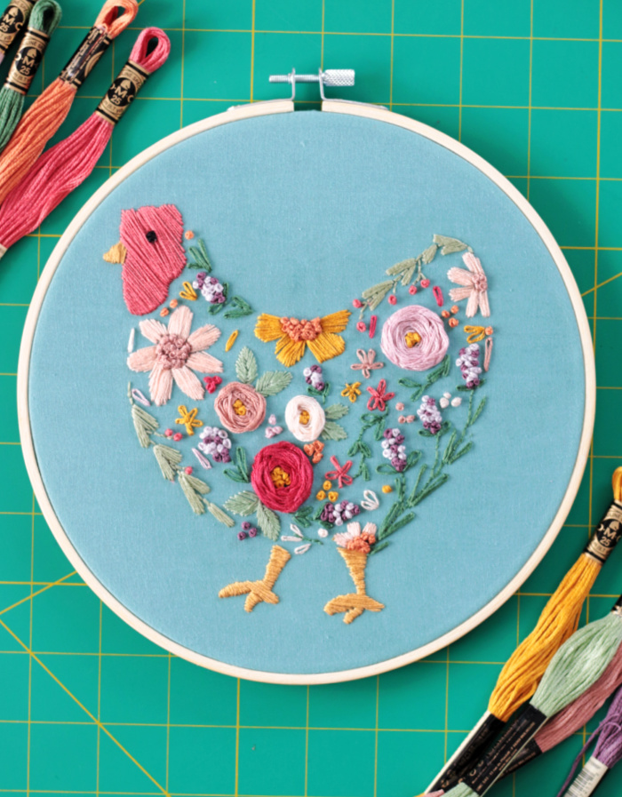 floral chicken embroidery project in embroidery hoop