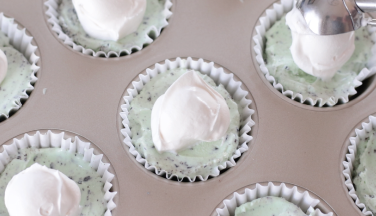 mint ice cream cups with scoop of cool whip on top