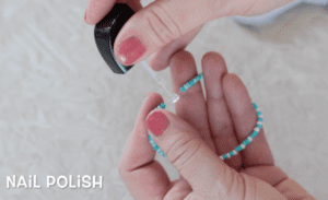 nail polish brushed onto bracelet knot